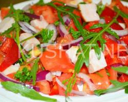 Salad with smoked chicken, tomatoes and cheese Salad with smoked chicken breast and tomatoes